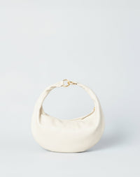 Off-white Piccola Ring Bag by HYER GOODS, a stylish hobo bag with a circular ring handle and soft leather finish.