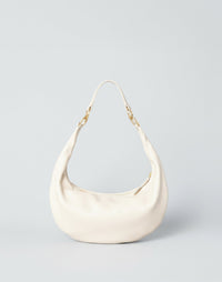 Off-white Piccola Ring Bag by HYER GOODS, a stylish hobo bag with a distinctive ring detail and soft, textured leather finish.