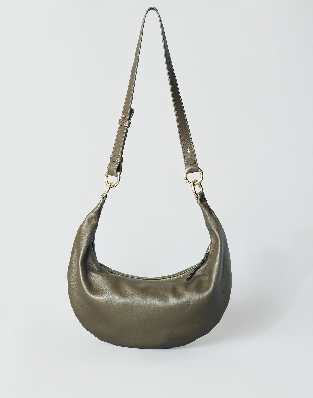 Olive nappa leather Piccola Ring Bag by HYER GOODS, a stylish hobo bag with a modern, rounded design and circular handle.