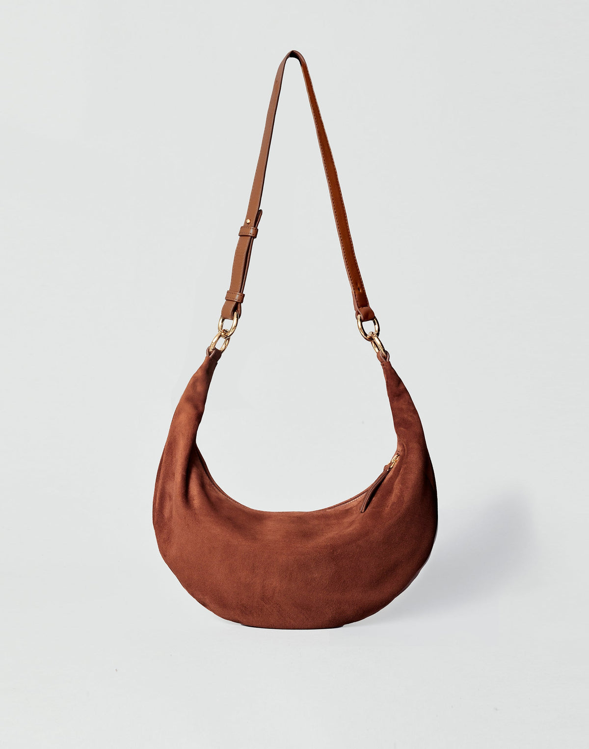 HYER GOODS Piccola Ring Bag hobo bag in praline suede featuring a rounded shape and stylish ring handle.