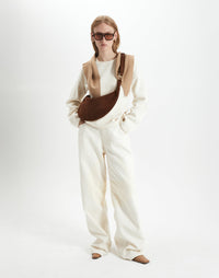 HYER GOODS Piccola Ring Bag hobo bag in praline suede with circular handle and minimalist design.