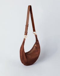 HYER GOODS Piccola Ring Bag hobo bag in praline suede with a rounded shape and stylish handle details.