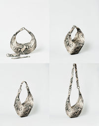 HYER GOODS Piccola Ring Bag hobo bag with python print, featuring a circular ring handle and compact design.