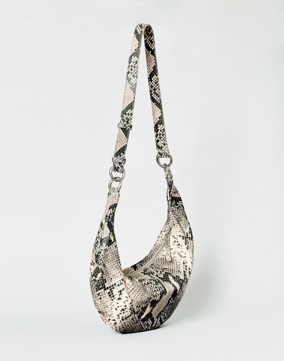 HYER GOODS Piccola Ring Bag hobo bag in python leather with circular ring handle and compact design.