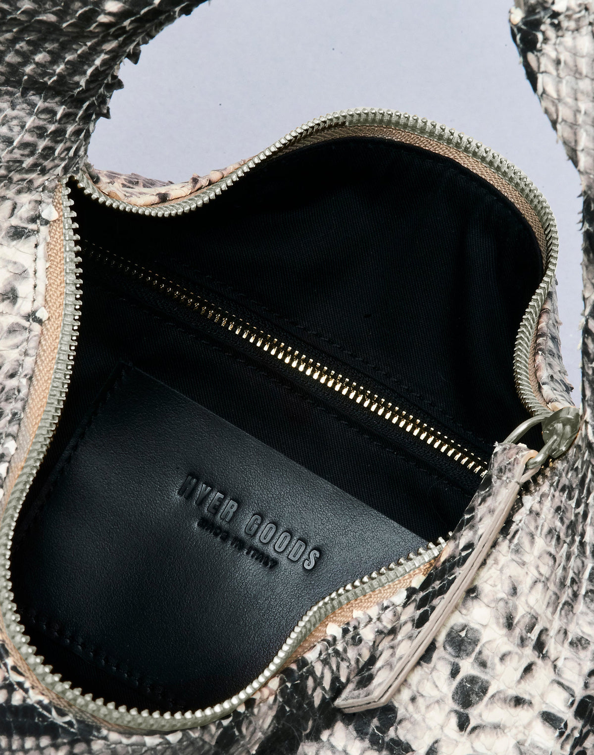 HYER GOODS Piccola Ring Bag hobo bag in Python leather with circular handle and compact design, stylish and functional for everyday use.