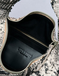 HYER GOODS Piccola Ring Bag hobo bag in Python leather with circular handle and compact design, stylish and functional for everyday use.