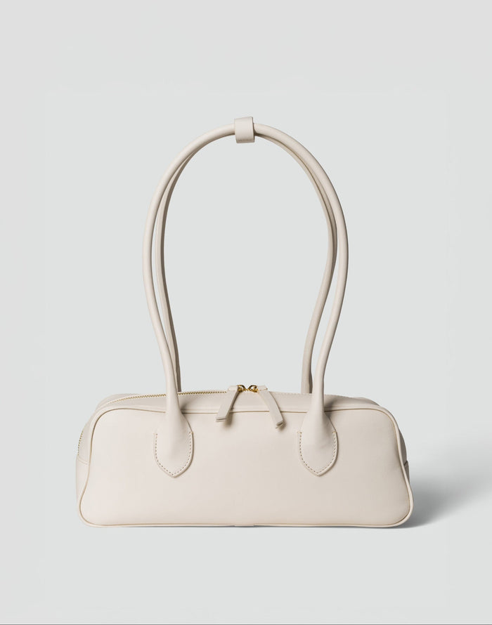 HYER GOODS La Strada East West Shoulder Bag in off-white with sleek design and minimalist style.