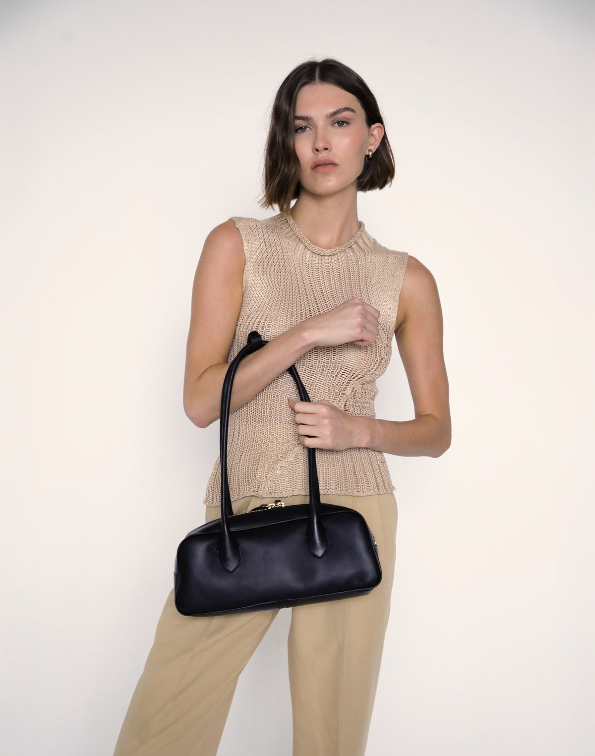 Black La Strada East West Shoulder Bag by HYER GOODS with sleek design and versatile style, shown from the front.