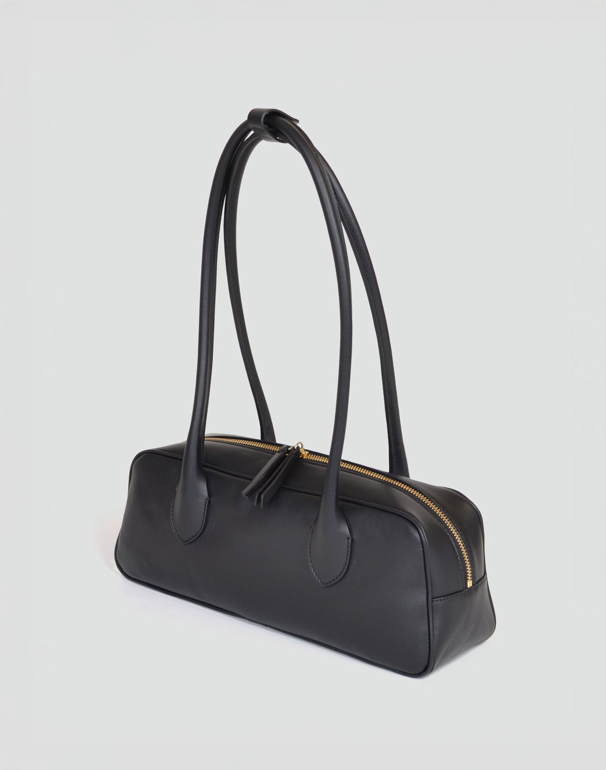 HYER GOODS La Strada East West Shoulder Bag in black, featuring a sleek design and adjustable strap.