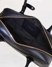 HYER GOODS La Strada East West shoulder bag in black with grey interior, showcasing a stylish and versatile design.