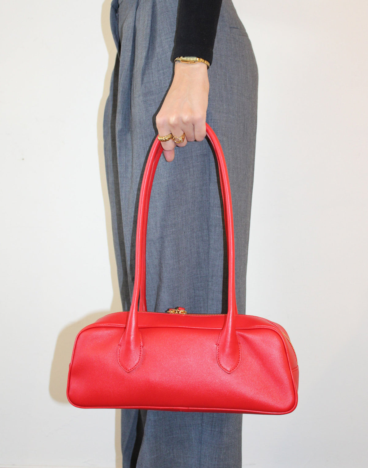 Red HYER GOODS La Strada East West shoulder bag with a stylish side view, showcasing its sleek design and structured shape.