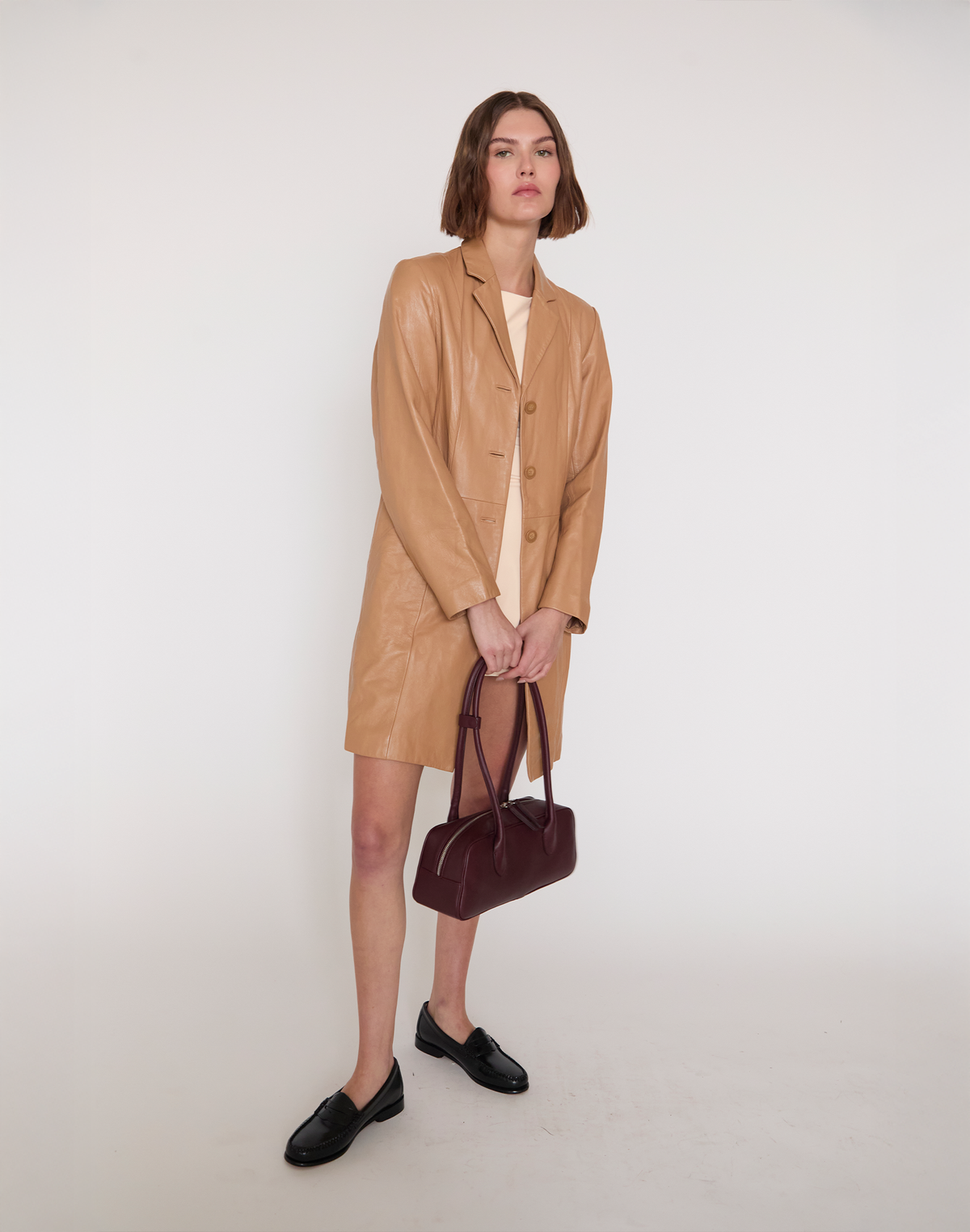 HYER GOODS La Strada East West shoulder bag in burgundy with leather strap and minimalist design.