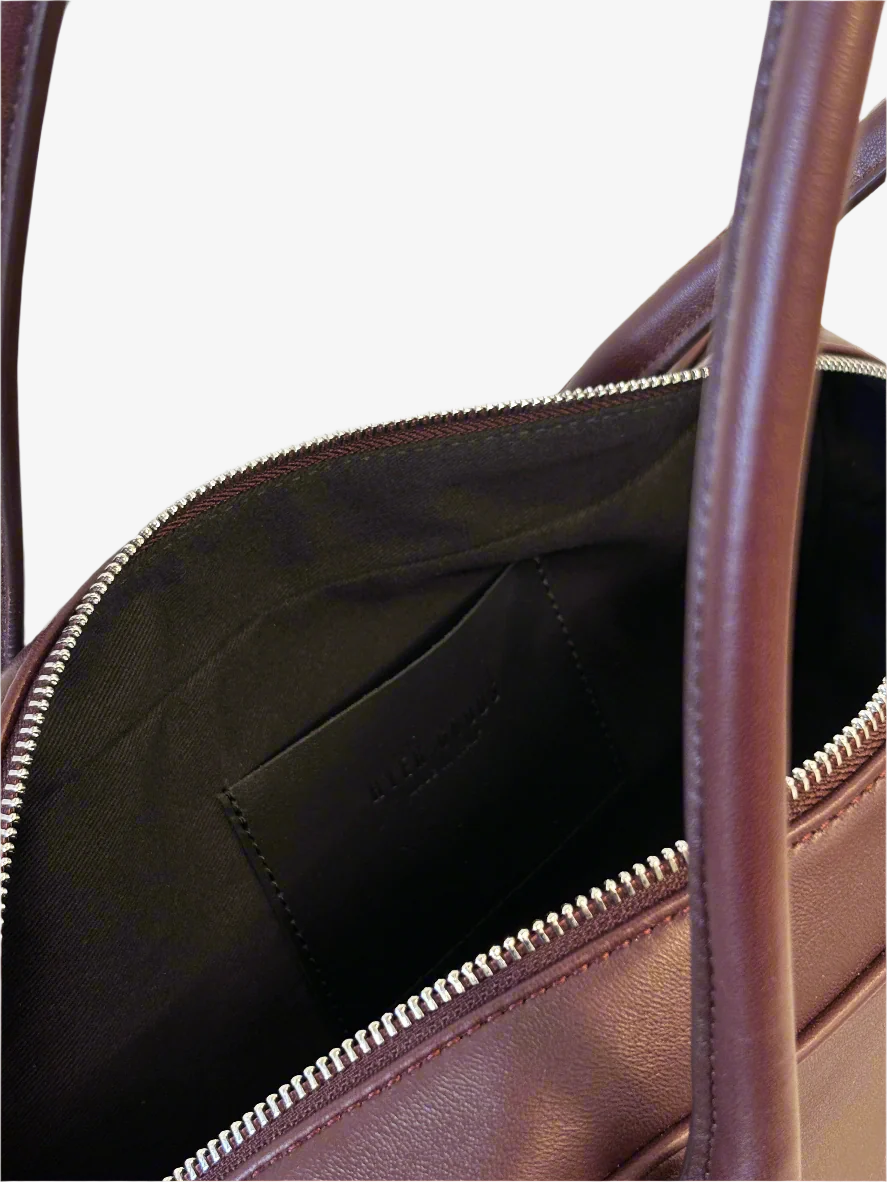 HYER GOODS La Strada East West Shoulder Bag in burgundy with grey interior, showcasing its spacious design and stylish craftsmanship.