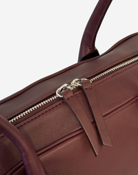 HYER GOODS La Strada East West Shoulder Bag in burgundy with detailed stitching and structured design.