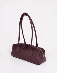 HYER GOODS La Strada East West Shoulder Bag in burgundy, showcasing its stylish design and compact size.