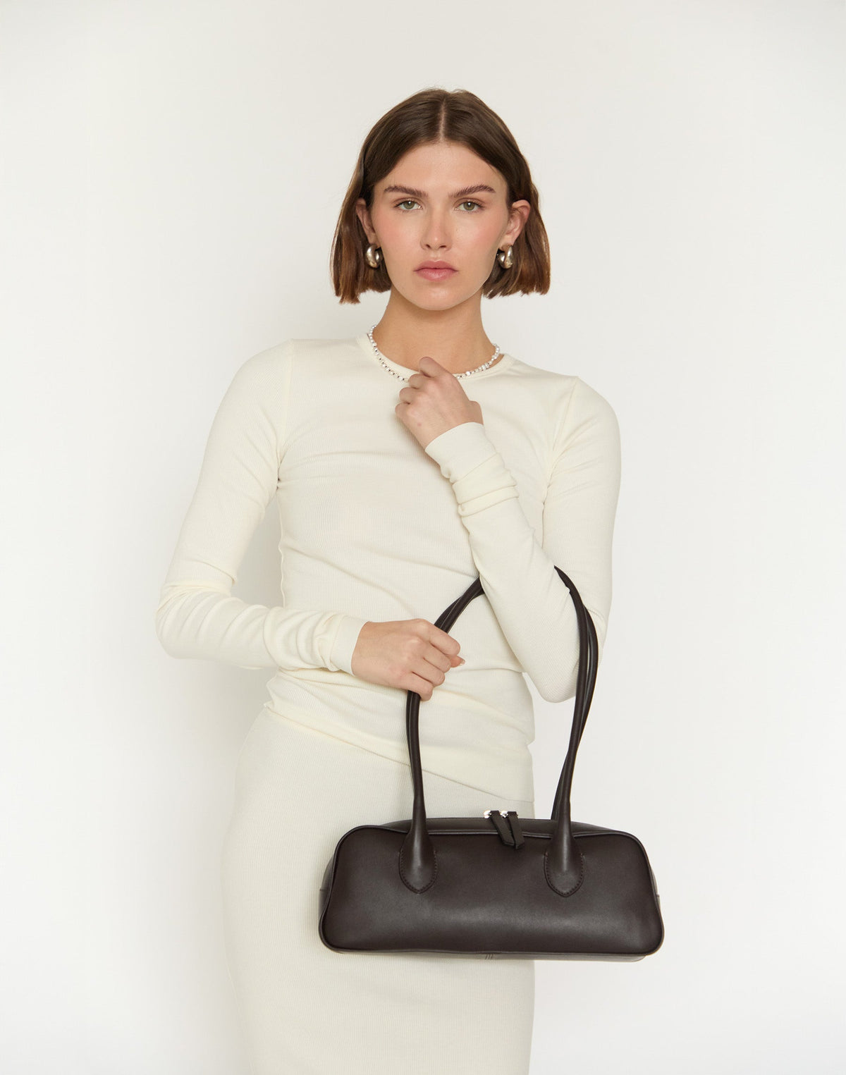 HYER GOODS La Strada East West Shoulder Bag in chocolate leather with a sleek, modern design and structured silhouette.