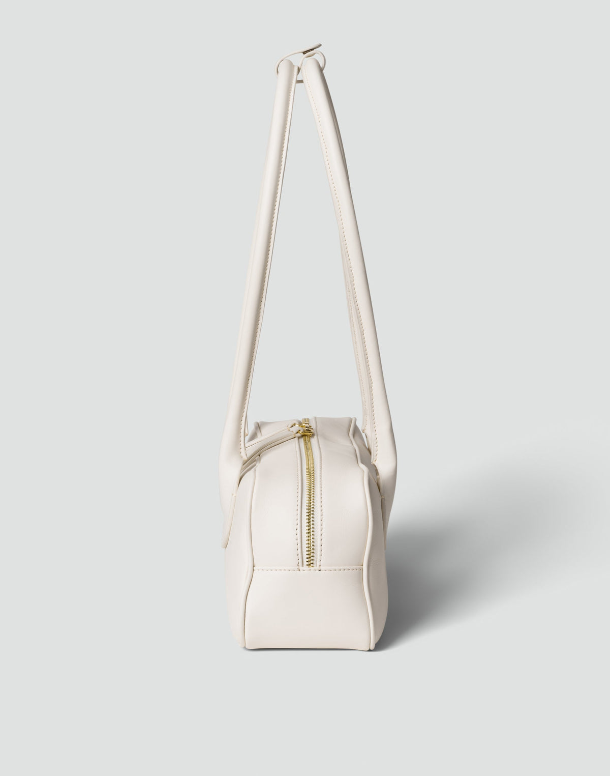 HYER GOODS La Strada East West Shoulder Bag in white leather with a sleek, minimalist design and gold-tone hardware.