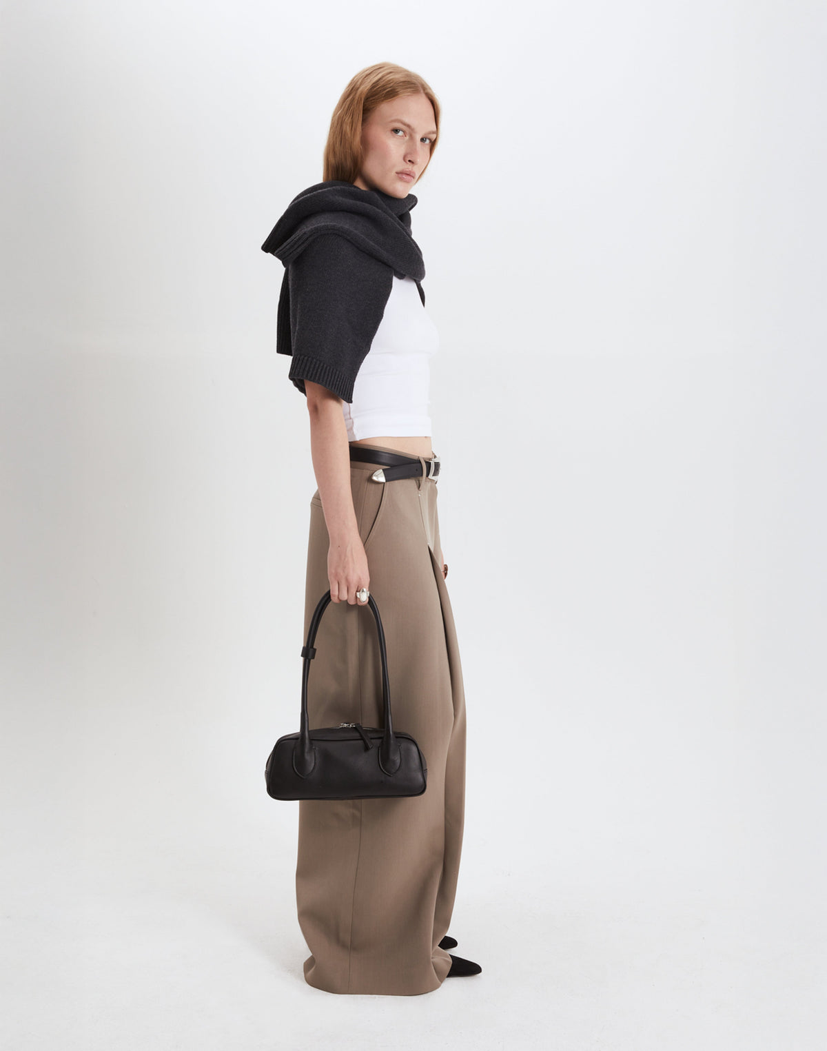 Black Mini La Strada East West Shoulder Bag by HYER GOODS with silver accents, featuring a compact design and adjustable strap.