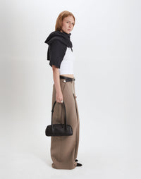 Black Mini La Strada East West Shoulder Bag by HYER GOODS with silver accents, featuring a compact design and adjustable strap.