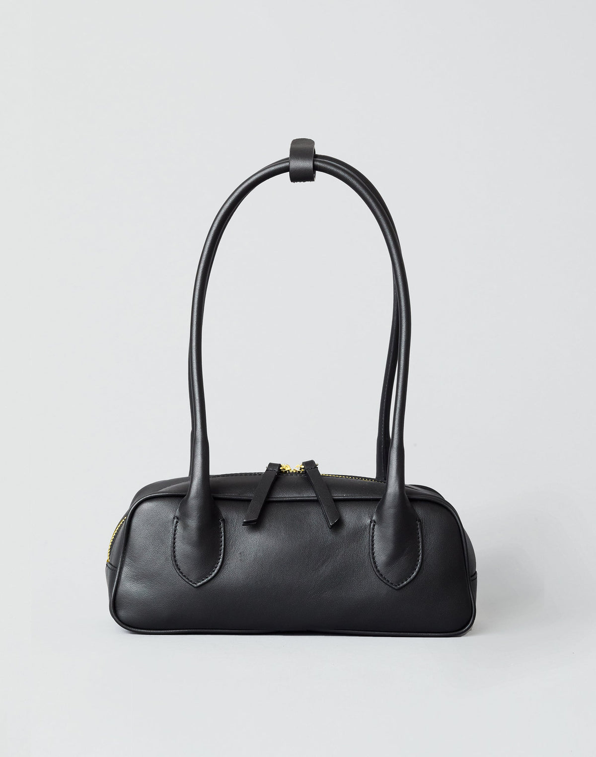 Black and gold Mini La Strada East West Shoulder Bag by HYER GOODS with sleek design and compact size.