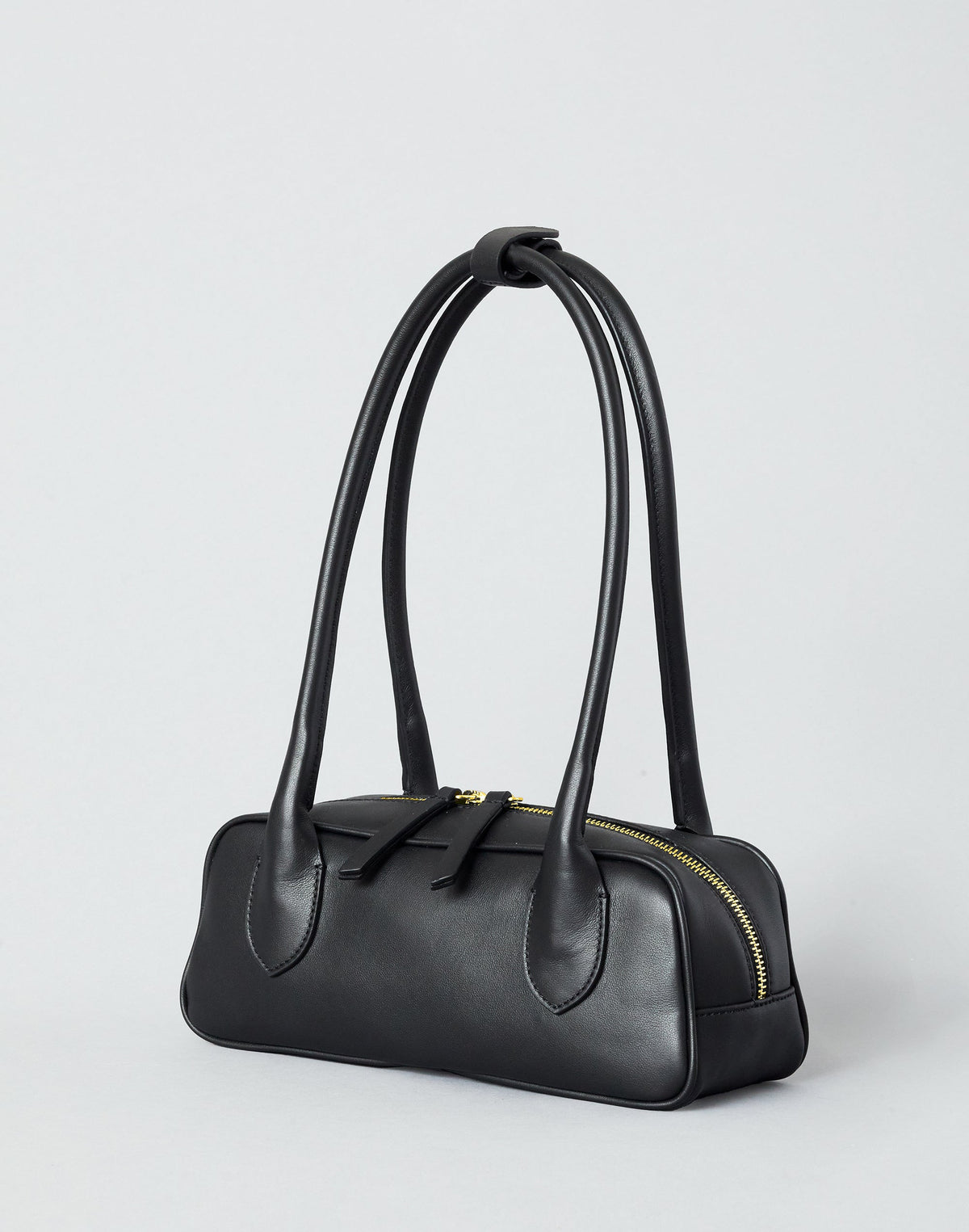 Black and gold Mini La Strada East West Shoulder Bag by HYER GOODS with sleek design and adjustable strap.