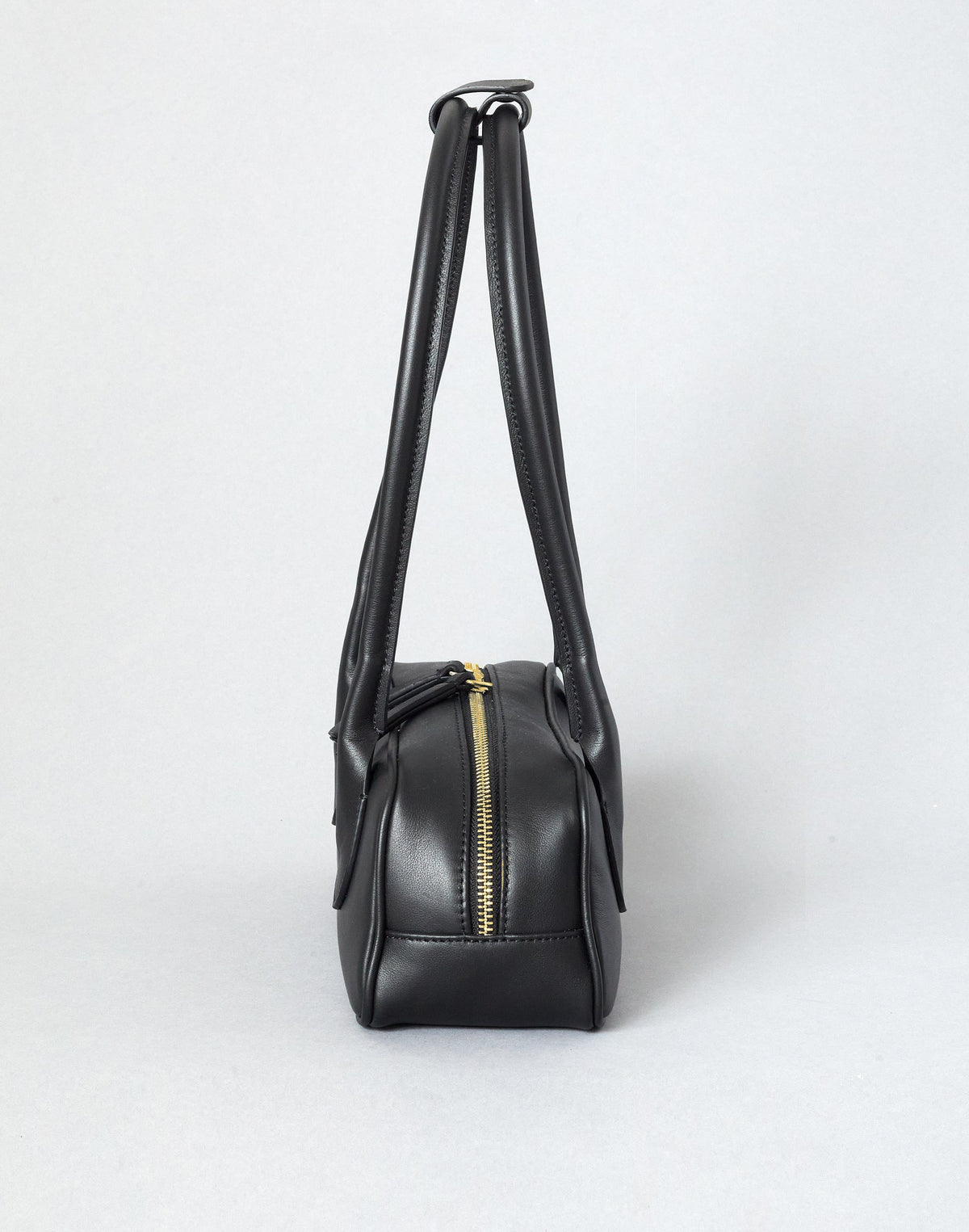 Black and gold Mini La Strada East West shoulder bag by HYER GOODS with sleek design and compact size, featuring a stylish, modern look.