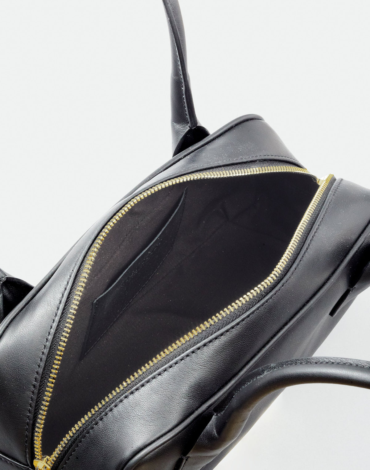 Black and gold Mini La Strada East West Shoulder Bag by HYER GOODS with sleek design and adjustable strap.