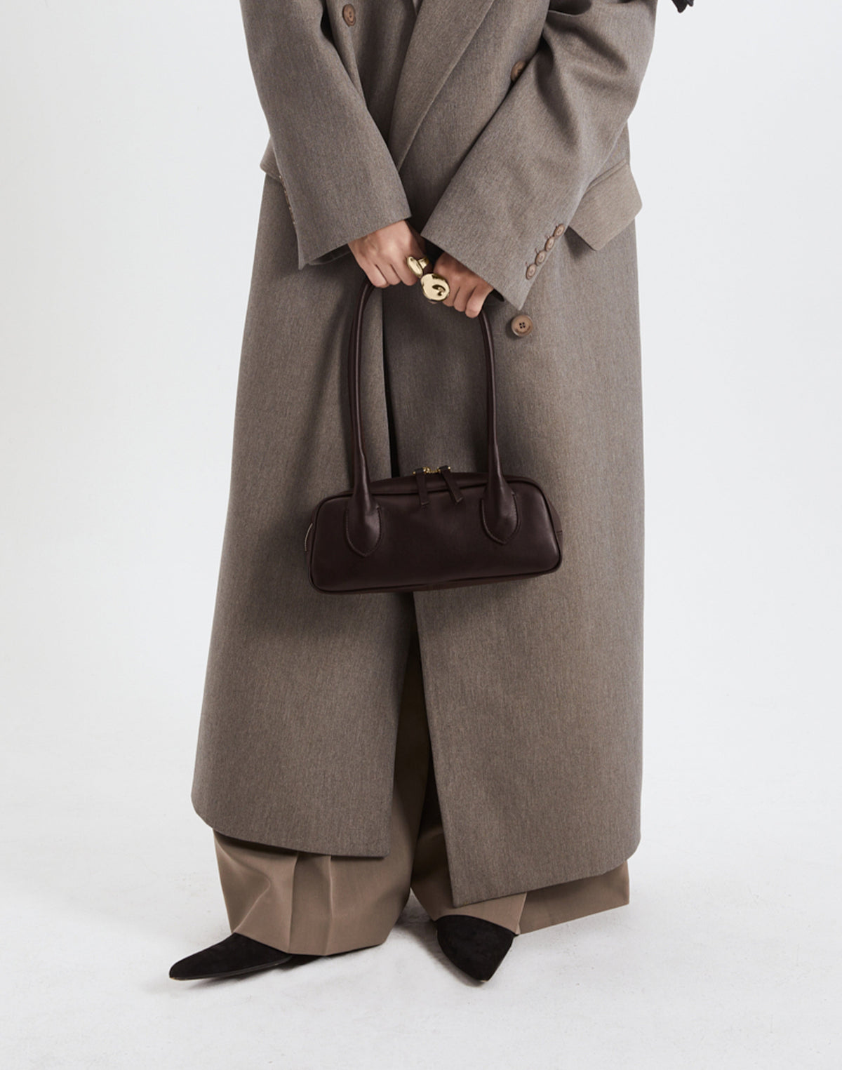 Mini La Strada East West shoulder bag by HYER GOODS in chocolate and gold leather with a sleek design.