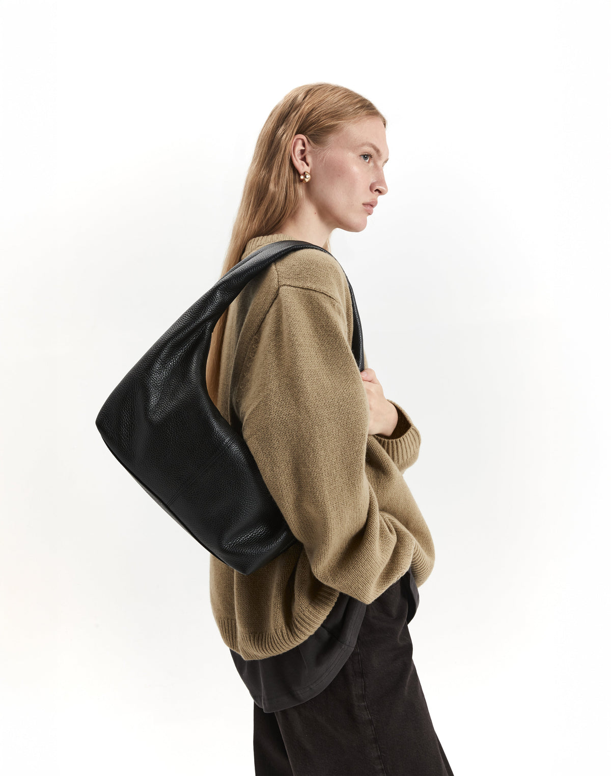 Black and gold HYER GOODS The Everyday Shoulder Bag with adjustable strap and sleek design, shown from the front.