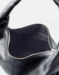 Black HYER GOODS Everyday Shoulder Bag with silver hardware, showing its sleek design and adjustable strap.