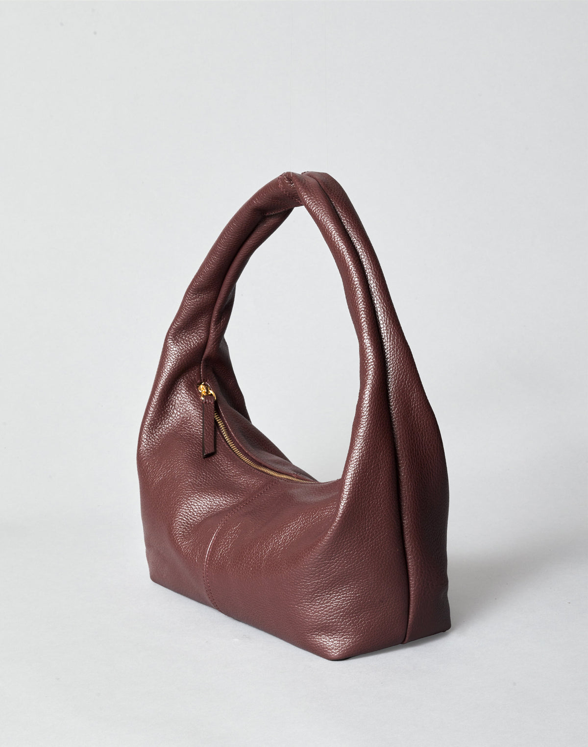 HYER GOODS Everyday Shoulder Bag in burgundy gold color, featuring a sleek leather design and adjustable strap.