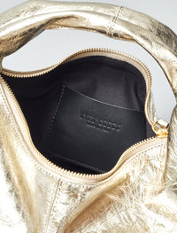 Gold mini everyday shoulder bag by HYER GOODS with sleek design and compact size, perfect for daily use.