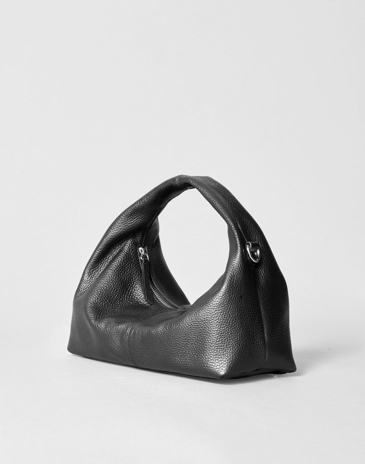 Black mini everyday shoulder bag by HYER GOODS with silver hardware, compact design, and adjustable strap in this product image.