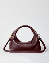 HYER GOODS Mini Everyday Shoulder Bag in burgundy with gold accents, compact design, and adjustable shoulder strap.