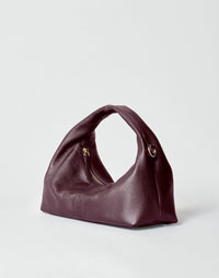 Mini Everyday Shoulder Bag by HYER GOODS in burgundy with a sleek design and adjustable strap, perfect for daily use.