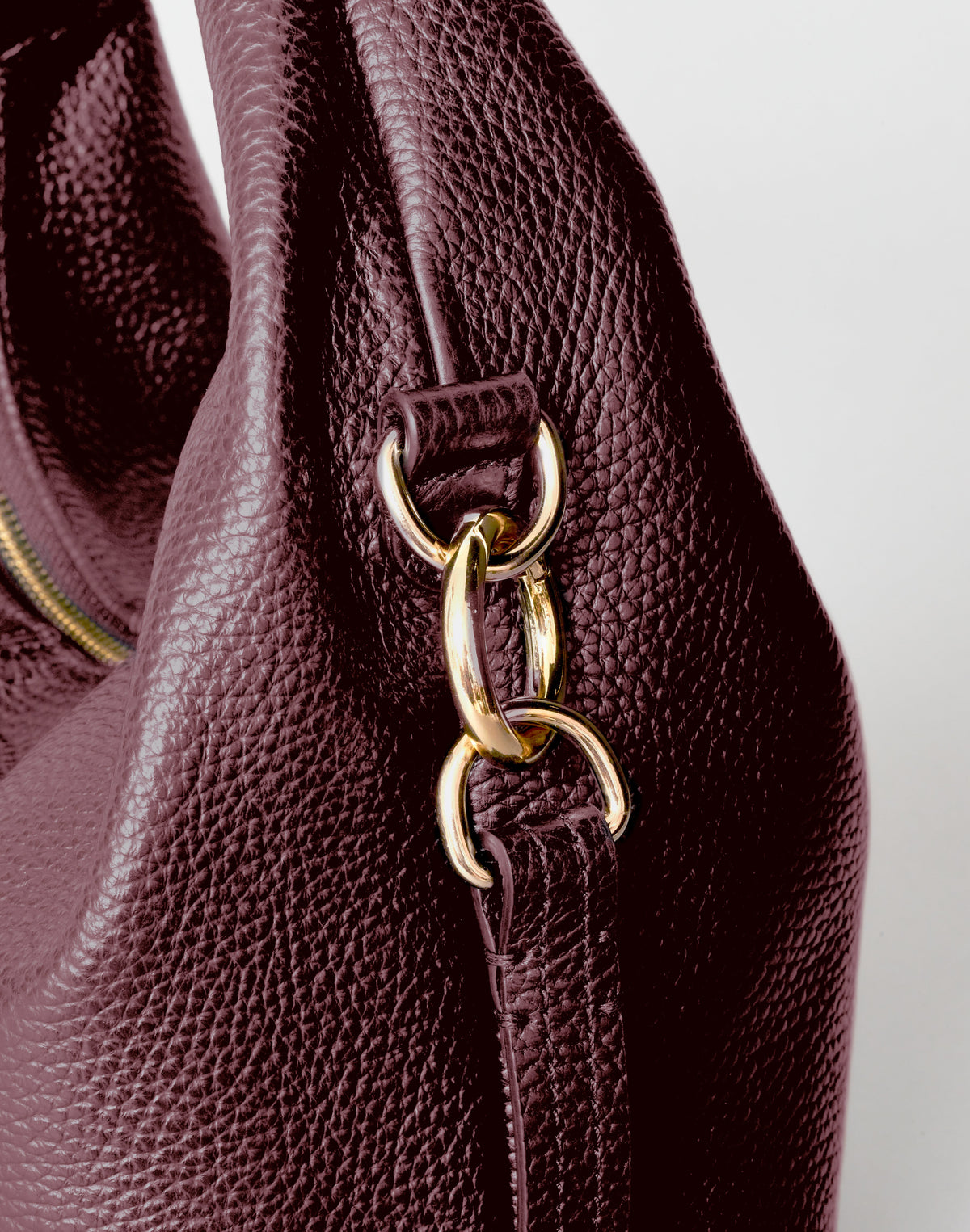Mini Everyday Shoulder Bag by HYER GOODS in burgundy, featuring a compact design with a sleek strap and minimalist style.