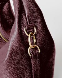 Mini Everyday Shoulder Bag by HYER GOODS in burgundy, featuring a compact design with a sleek strap and minimalist style.