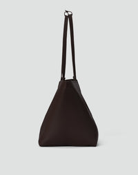 Dark chocolate HYER GOODS Mercato Tote Bag shown from the side, showcasing its soft fabric and spacious design.