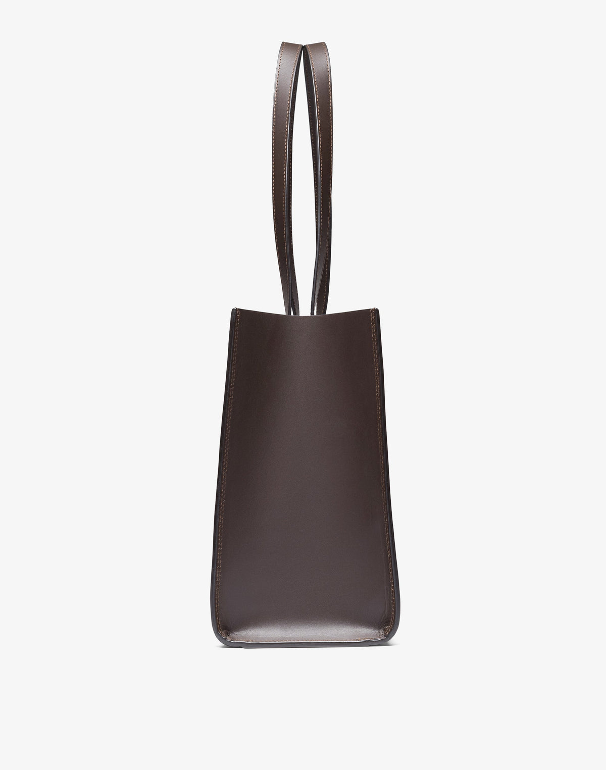 HYER GOODS Tolentino Tote Bag in double-face chocolate leather, showing side view of stylish, spacious tote with smooth finish.
