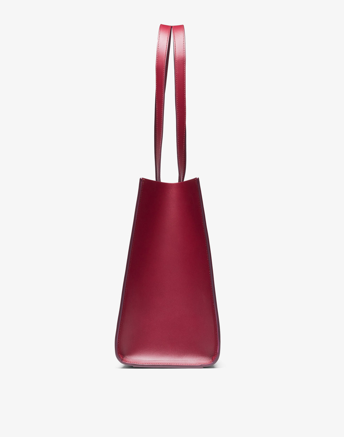 HYER GOODS Tolentino tote bag made of double-face leather in burgundy, showing side view with sleek design and sturdy handles.