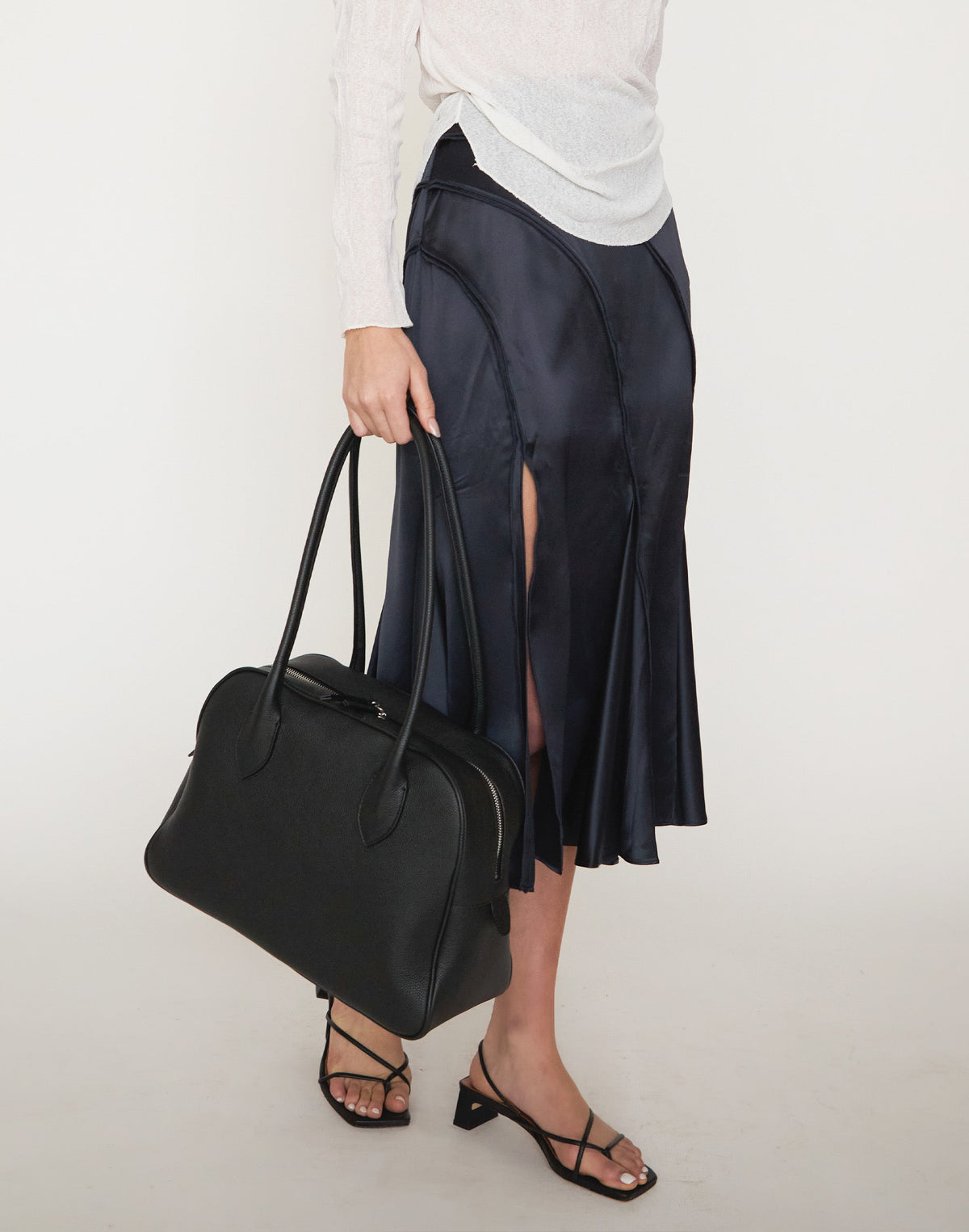 Black HYER GOODS La Autostrada tote bag with sleek design, spacious interior, and sturdy handles for everyday use.
