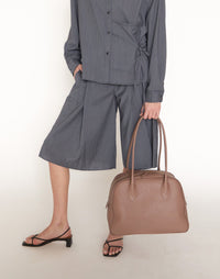 HYER GOODS La Autostrada Tote Bag in taupe, featuring durable fabric and spacious interior, held open to showcase its design.