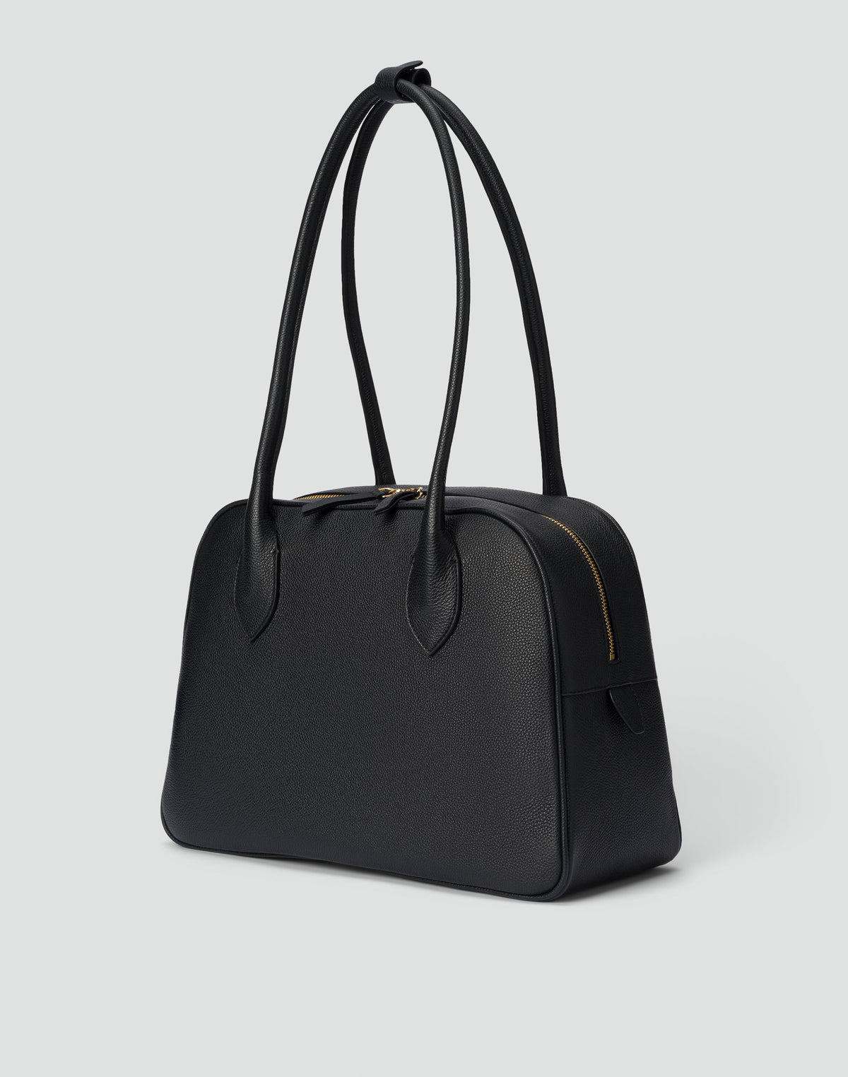 Black and gold La Autostrada Tote Bag by HYER GOODS with sleek design and sturdy handles, perfect for everyday use.