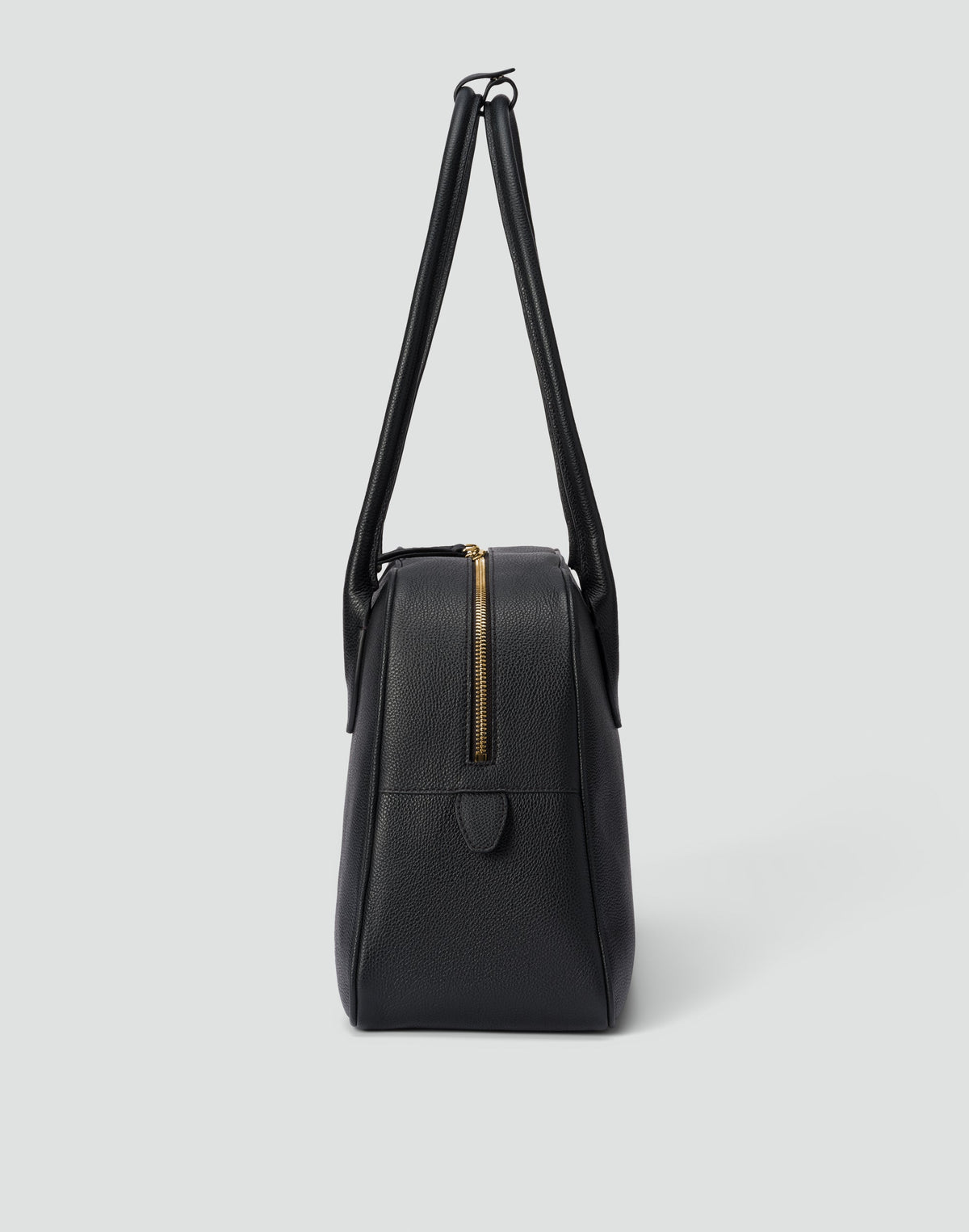Black and gold La Autostrada tote bag by HYER GOODS with sleek design and sturdy handles, shown from a front view.
