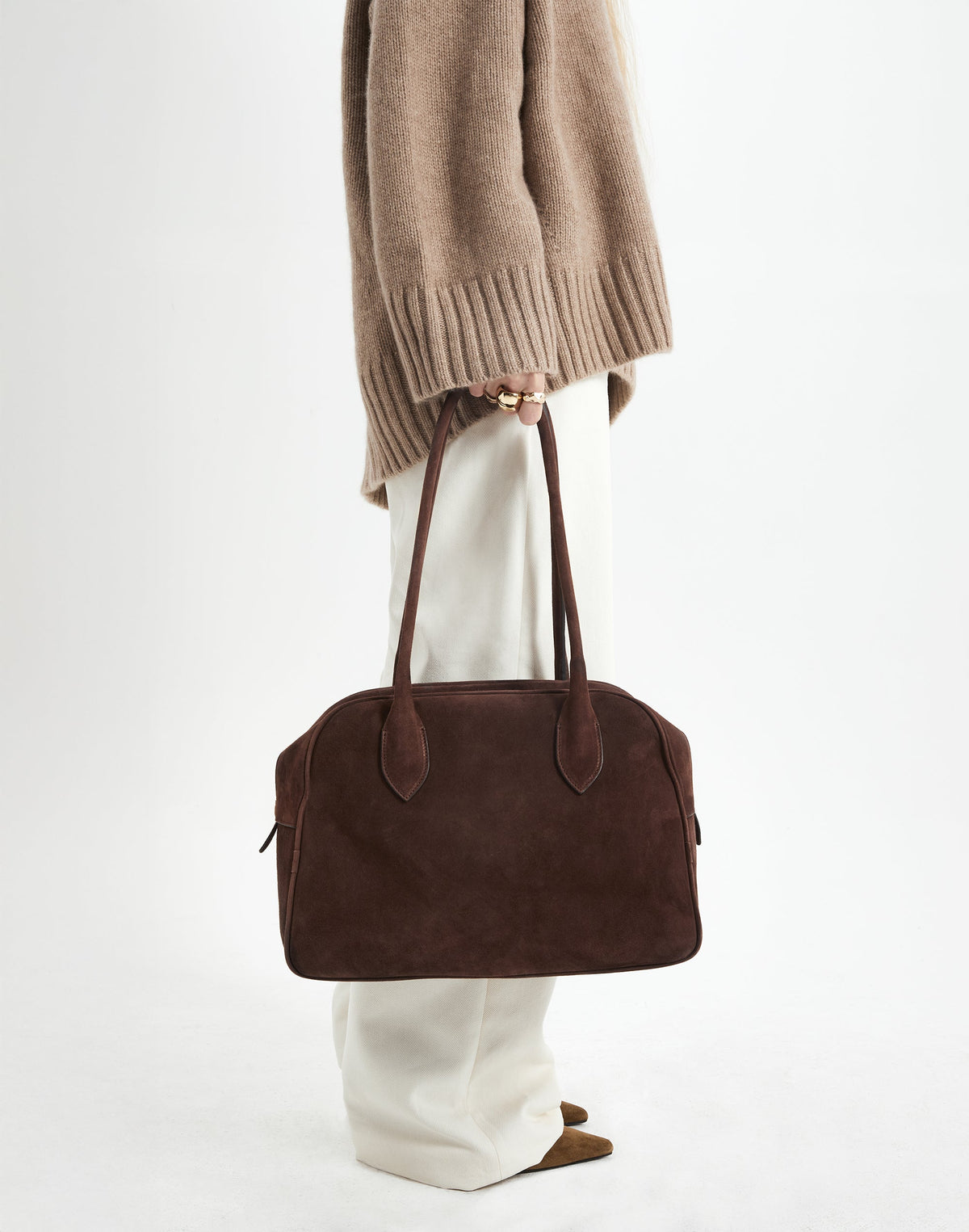 HYER GOODS La Autostrada tote bag in brown suede, showing its spacious design and sturdy handles.