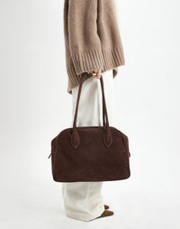 HYER GOODS La Autostrada tote bag in brown suede, showing its spacious design and sturdy handles.