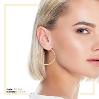 14K gold-filled slit cut hoop earrings for women, JB Jewelry BLVD design hoops, 25-80 mm size worn by a model.