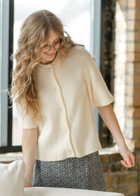 Inherit Co. Zadie Ivory short sleeve button cardigan from IC Layering Essentials, featuring a soft knit and classic design.