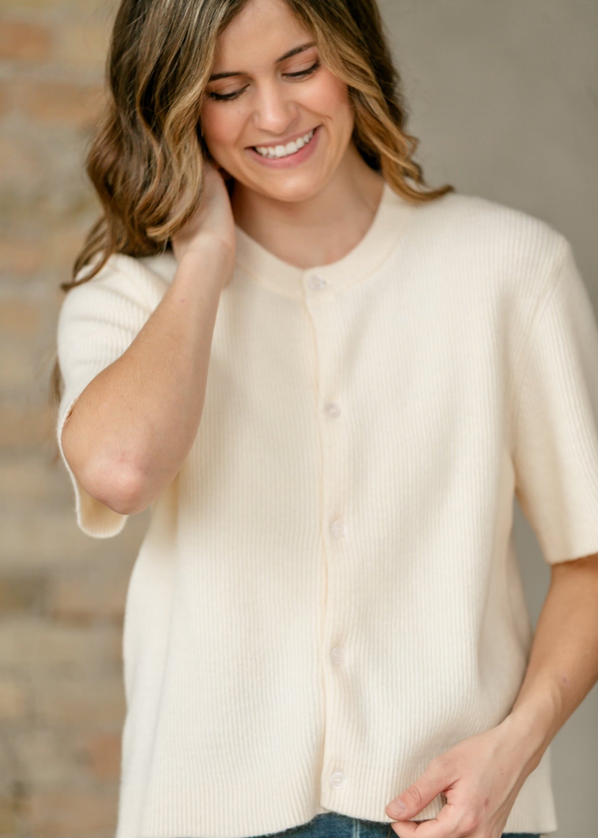 Ivory short sleeve button cardigan from Inherit Co.'s IC Layering Essentials, featuring a cozy, lightweight knit and stylish design.