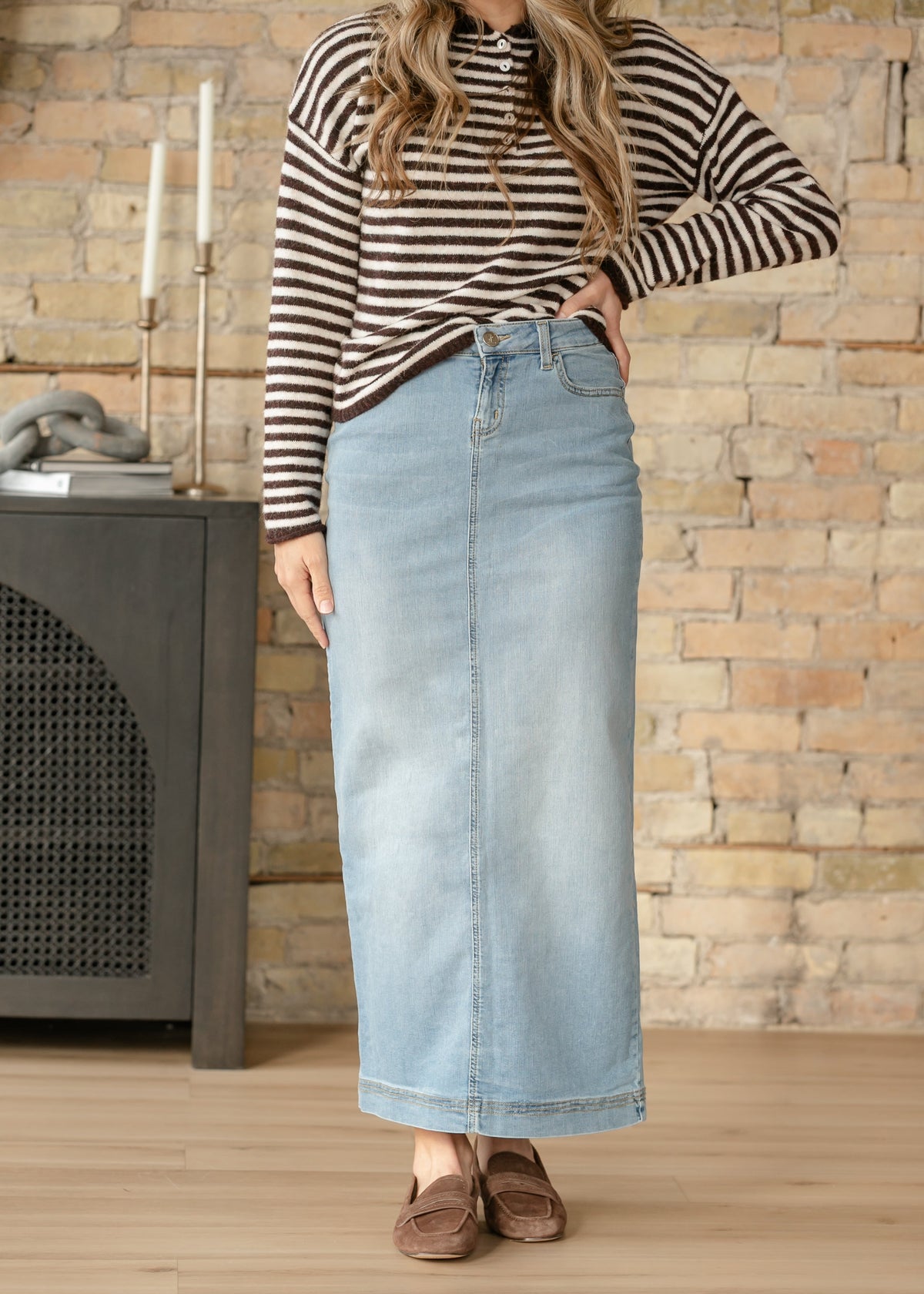 Light wash denim maxi skirt by Inherit Co. featuring a flowy silhouette, high waist, and casual, stylish design.